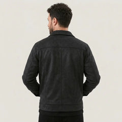 Back view of a man wearing a black suede-look trucker jacket