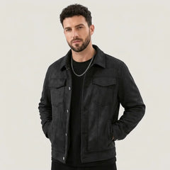 Man wearing a black suede-look trucker jacket over a black tee, front view