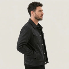 Man in a black suede-look trucker jacket, side profile view