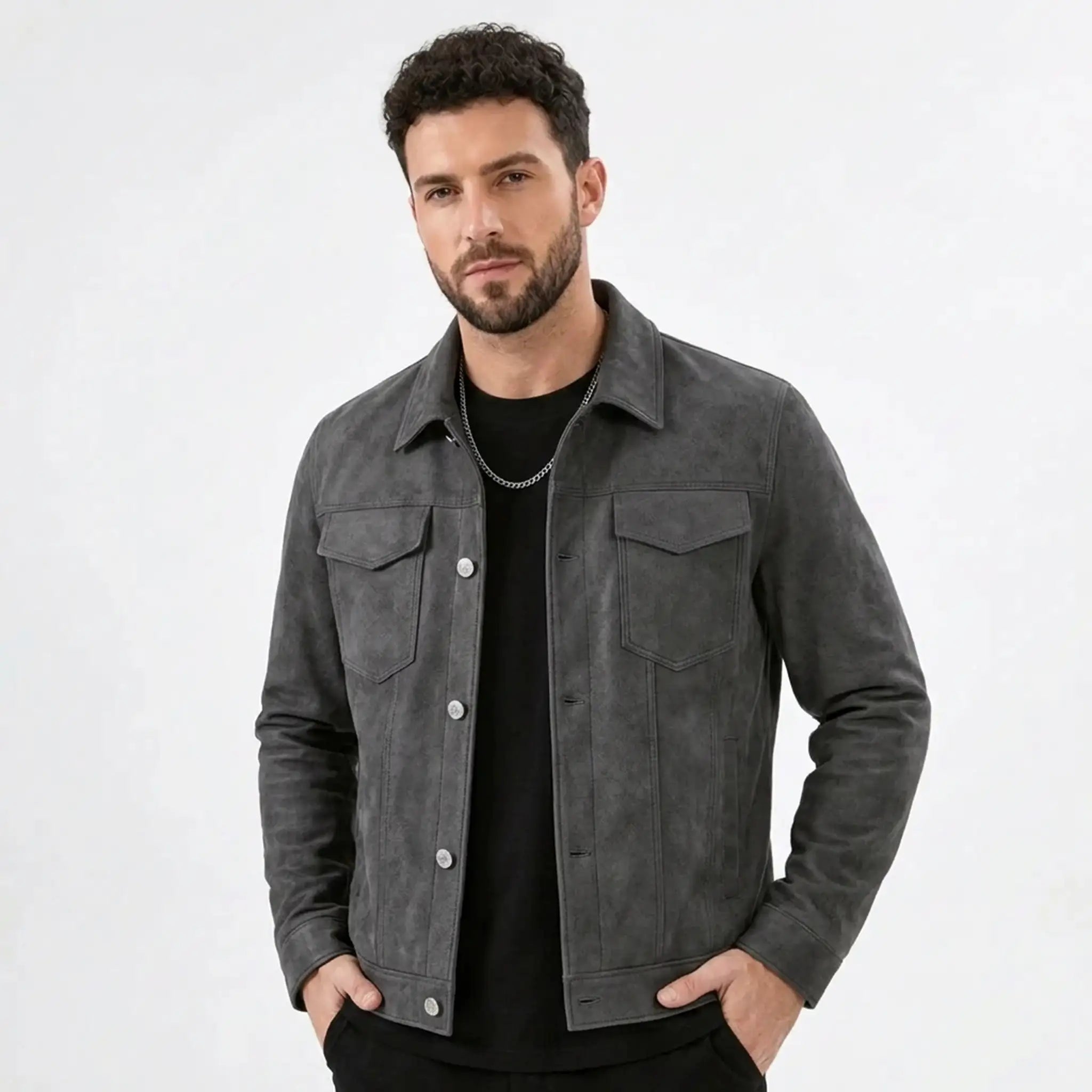 Man wearing a gray suede-look trucker jacket over a black tee, front view