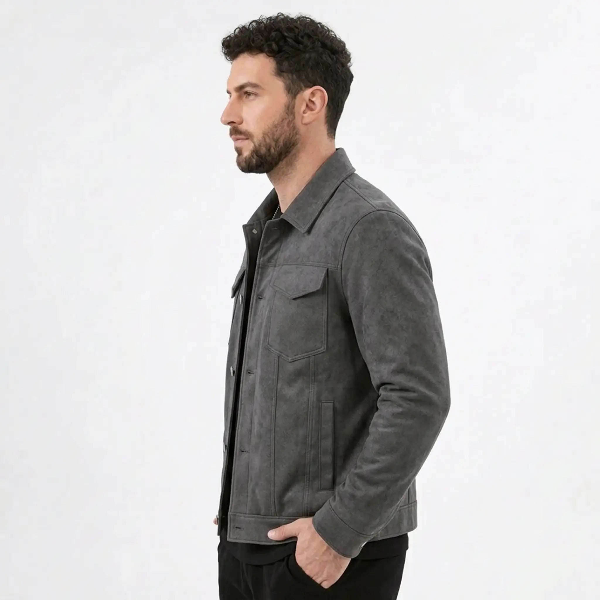Man in a gray suede-look trucker jacket, side profile view