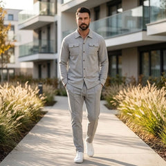 Gray waffle knit set worn walking a modern city path