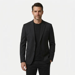 MannerCo men's black wool blend blazer, two-button slim fit, front view over black tee