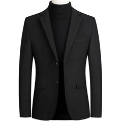 Black wool blend blazer on a mannequin with notch lapel and flap pockets, front view