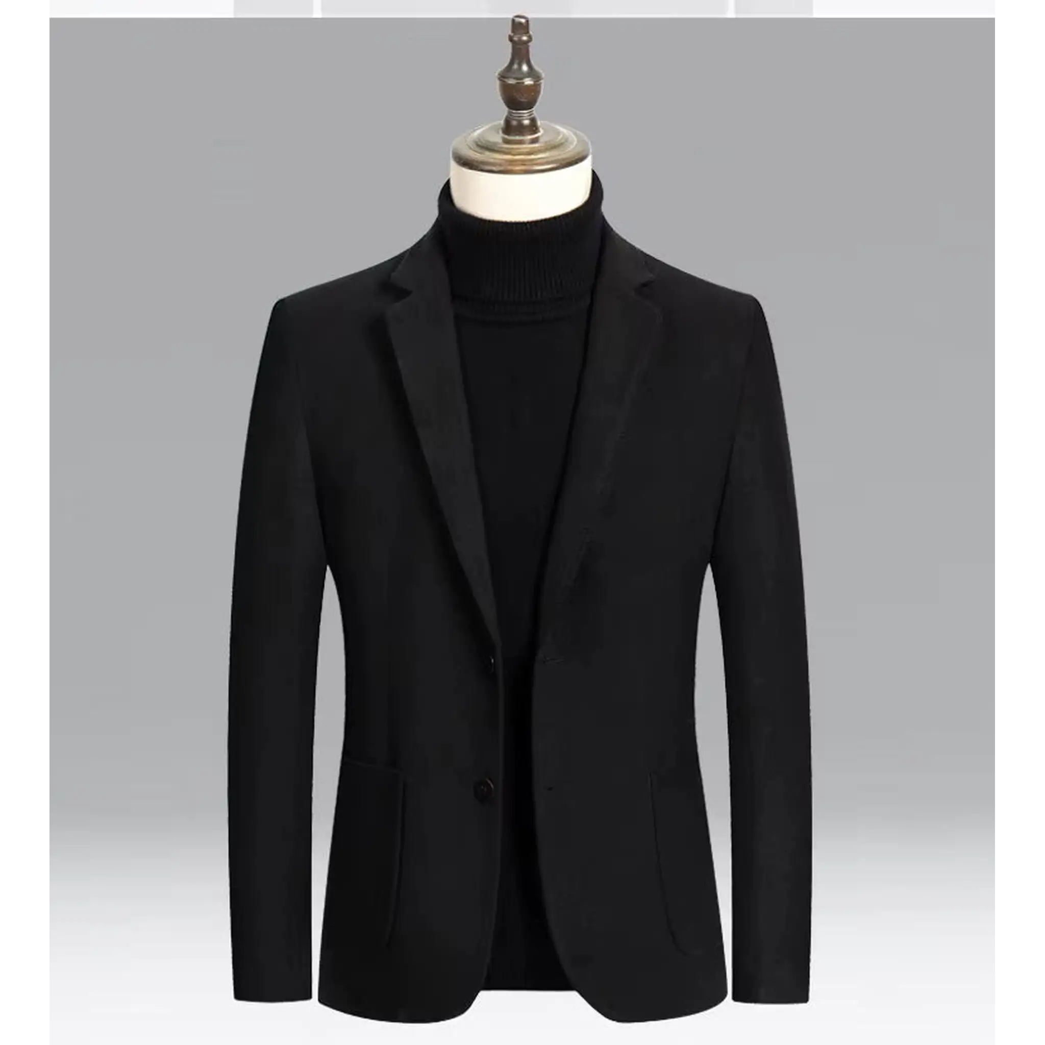 Black wool blend blazer on a mannequin over a black turtleneck, front view
