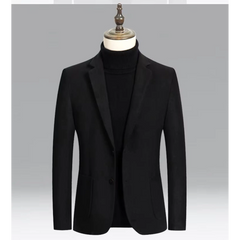 Black wool blend blazer on a mannequin over a black turtleneck, front view
