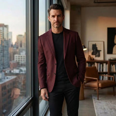 Claret wool blend blazer worn by a window in a city apartment