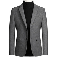 Grey wool blend blazer on a mannequin with notch lapel and flap pockets, front view