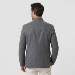 MannerCo men's gray double-faced wool overcoat with stand collar back view on male model