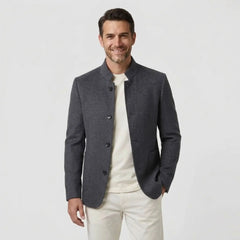 MannerCo men's gray double-faced wool overcoat with stand collar worn with cream tee front view