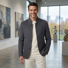 MannerCo men's gray double-faced wool overcoat with stand collar worn in art gallery lifestyle indoor