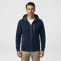 MannerCo men's navy blue zip-up fleece hoodie, front view with beige chinos