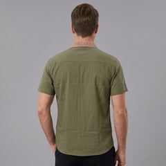 MannerCo military green linen blend short sleeve shirt with contrast collar, back view on male model