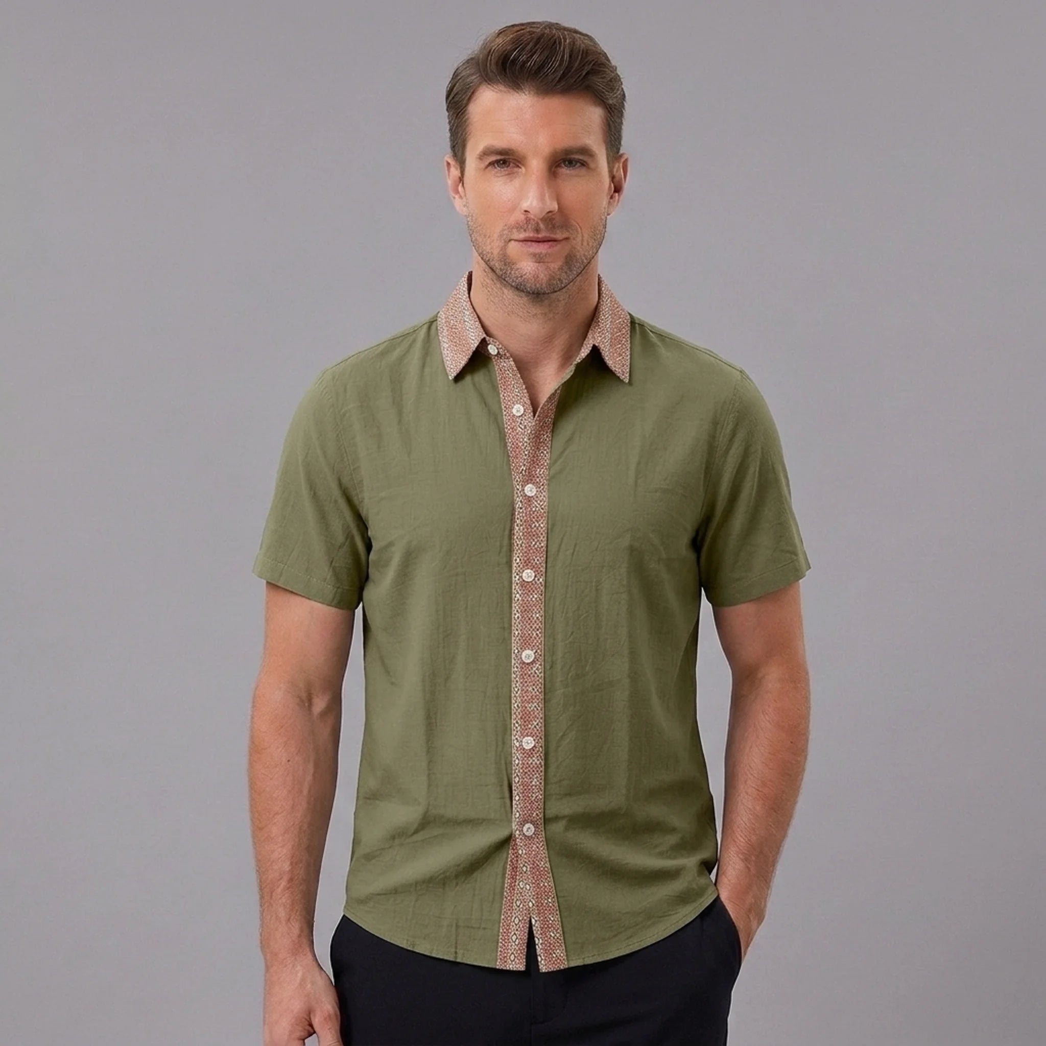 MannerCo military green linen blend short sleeve shirt with contrast paisley collar and button placket, front view