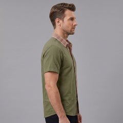 MannerCo military green linen blend short sleeve shirt with contrast floral collar, side view on male model