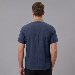 MannerCo navy blue linen blend short sleeve shirt with contrast collar, back view on male model