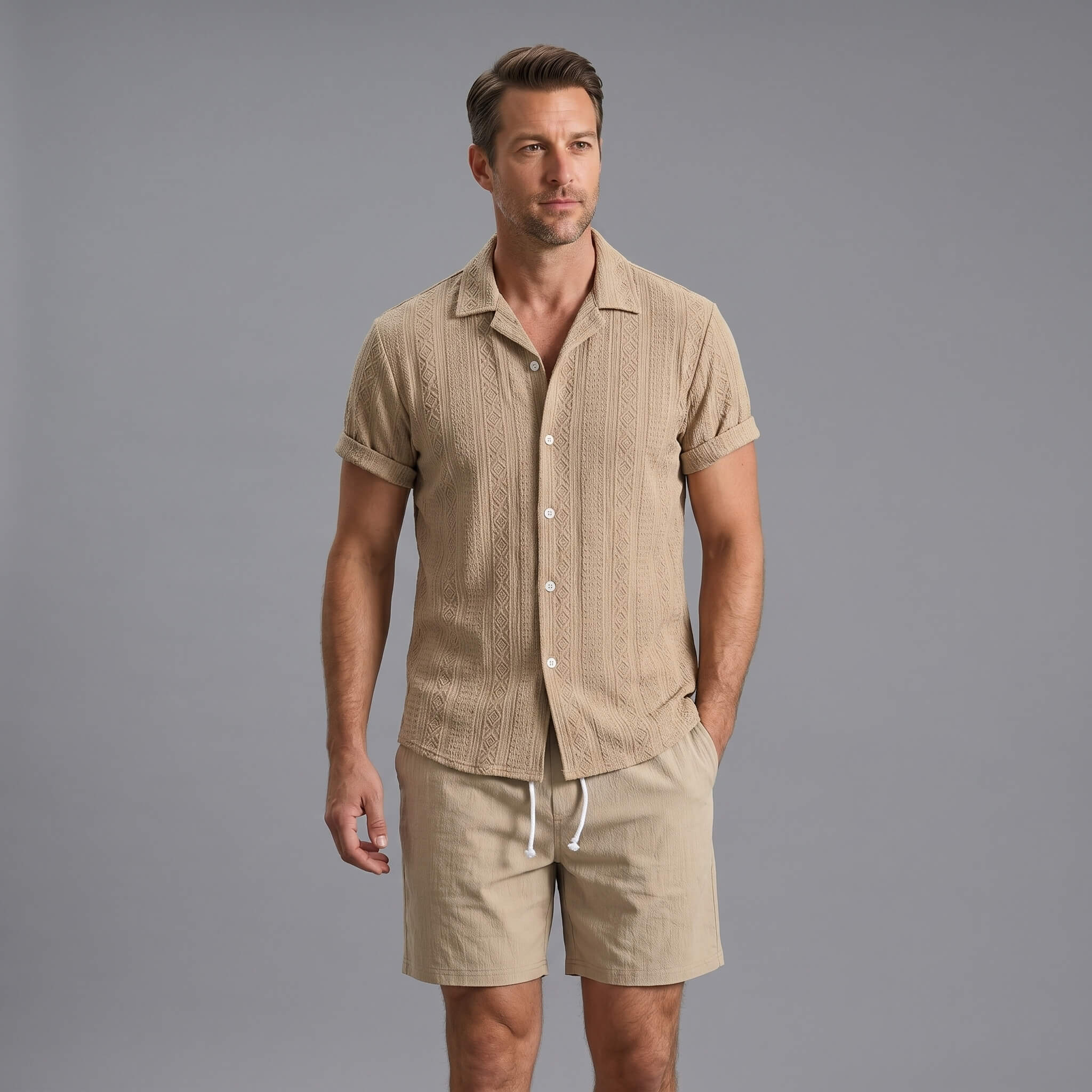 Man wearing a navy geometric jacquard button up shirt and crinkle textured shorts front view on plain background