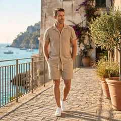Man wearing navy geometric jacquard shirt and crinkle shorts in outdoor lifestyle setting