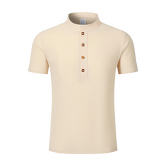 Man wearing a navy blue linen jacquard short sleeve polo shirt front view on plain background