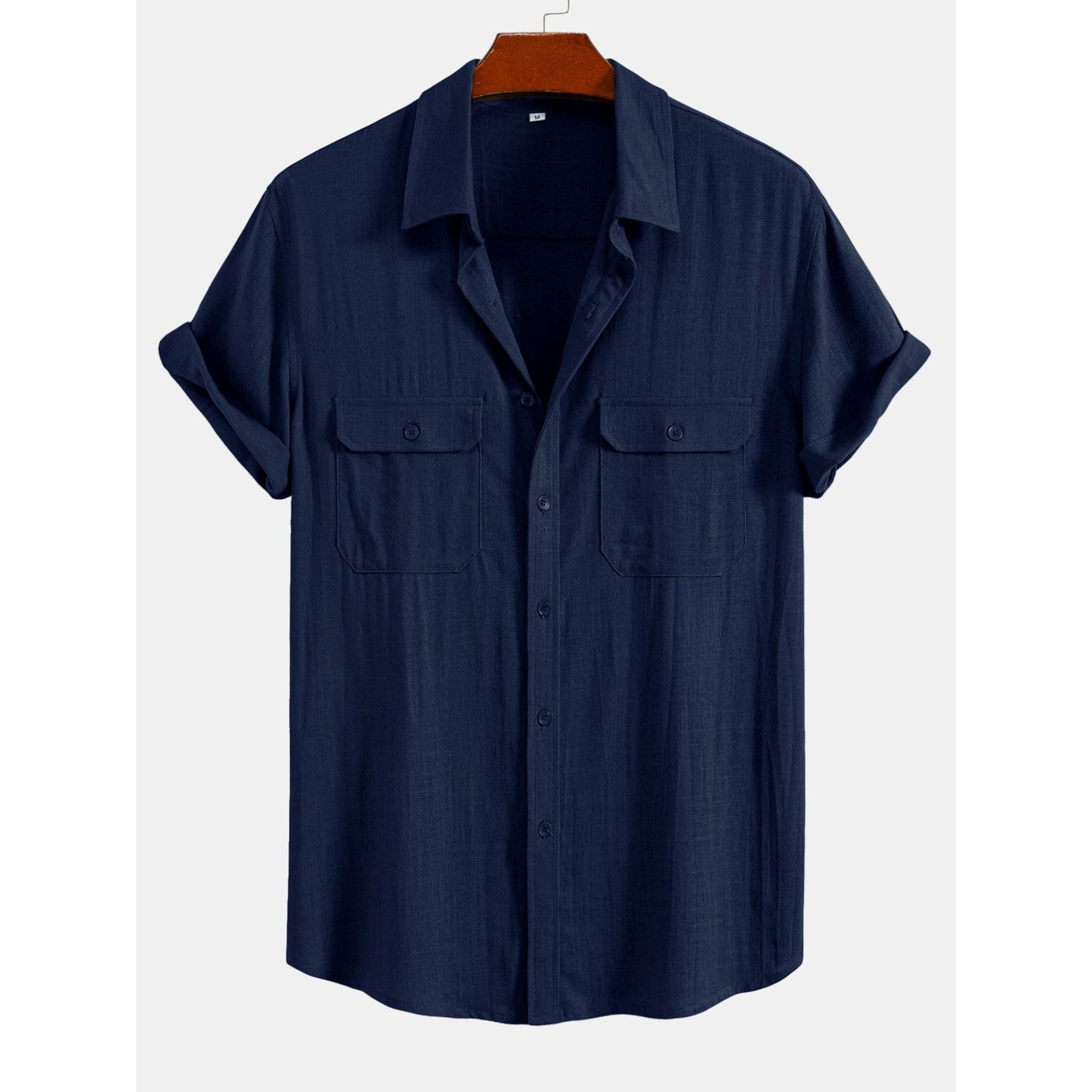 Navy blue short-sleeve shirt on a hanger with a white background