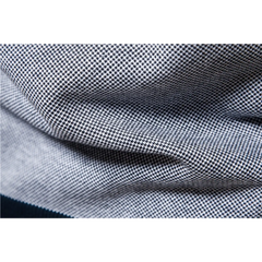 MannerCo navy raglan sleeve cardigan sweater fabric close-up showing fine knit texture and weave