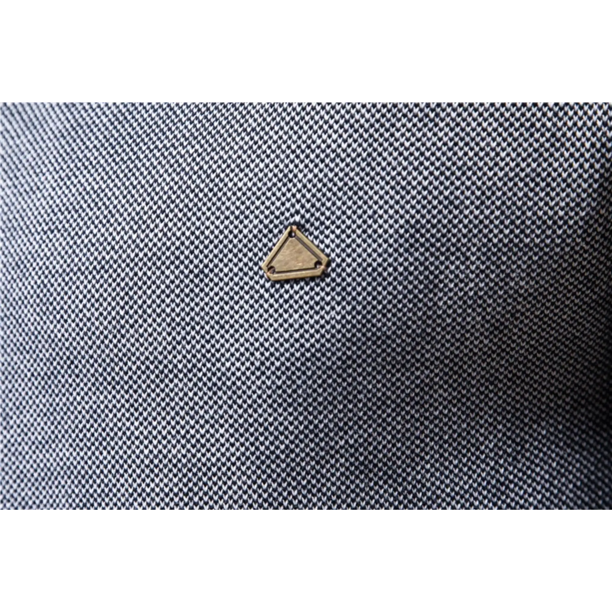 MannerCo navy cardigan sweater gold triangle logo detail on textured fabric