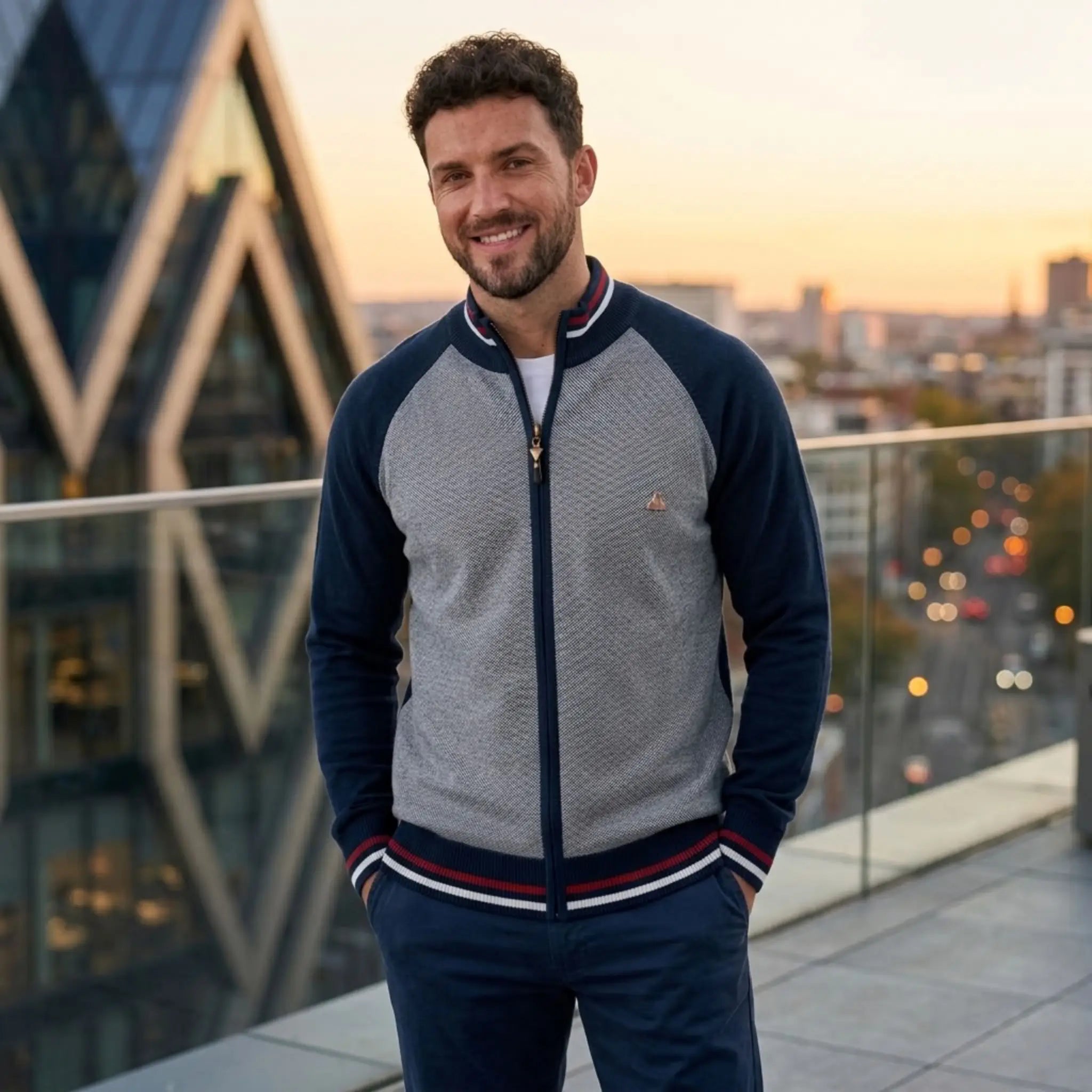 MannerCo navy raglan sleeve cardigan sweater with slim fit and stand-up collar worn outdoors