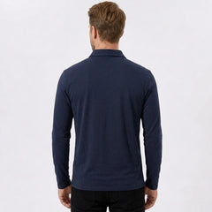 Back view of man wearing navy solid long sleeve cotton polo shirt