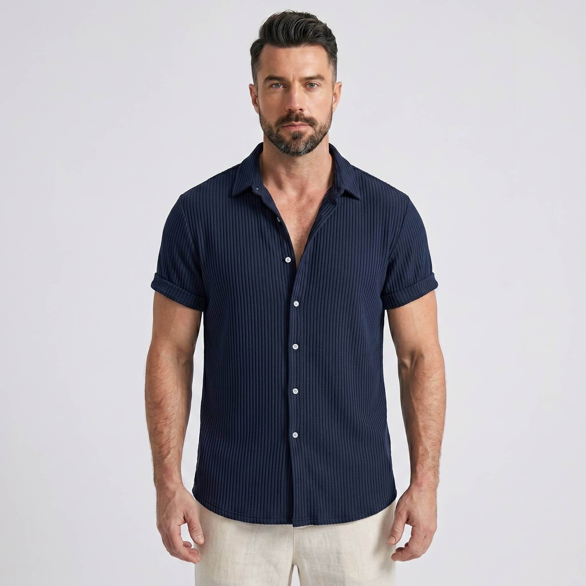 Back view of man wearing navy waffle button up shirt and straight leg linen pants