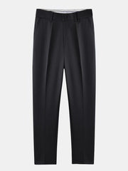 Man wearing navy waffle johnny collar polo and slim fit tapered pants outdoor lifestyle scene