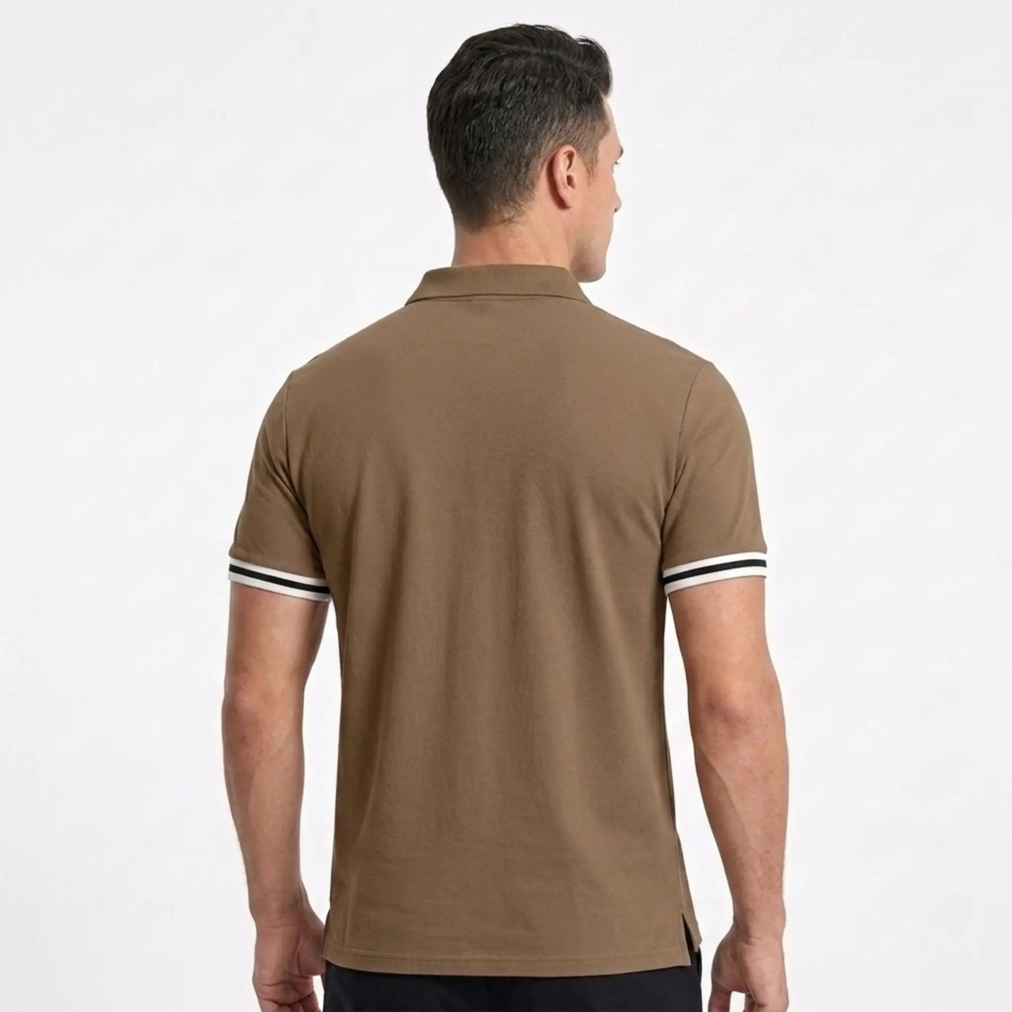MannerCo brown polo shirt back view with white and black striped cuffs on male model