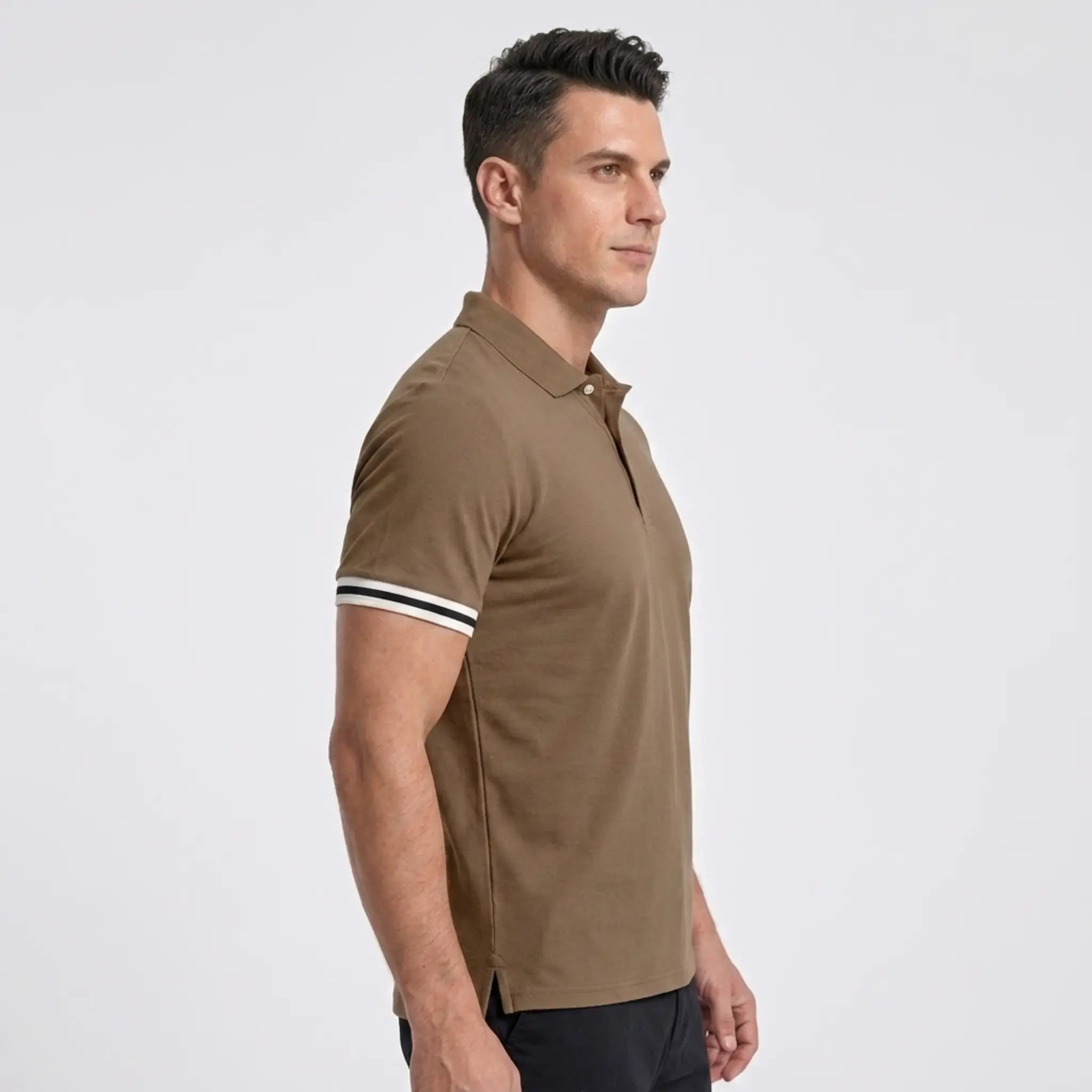 MannerCo khaki polo shirt side view with striped cuffs on male model