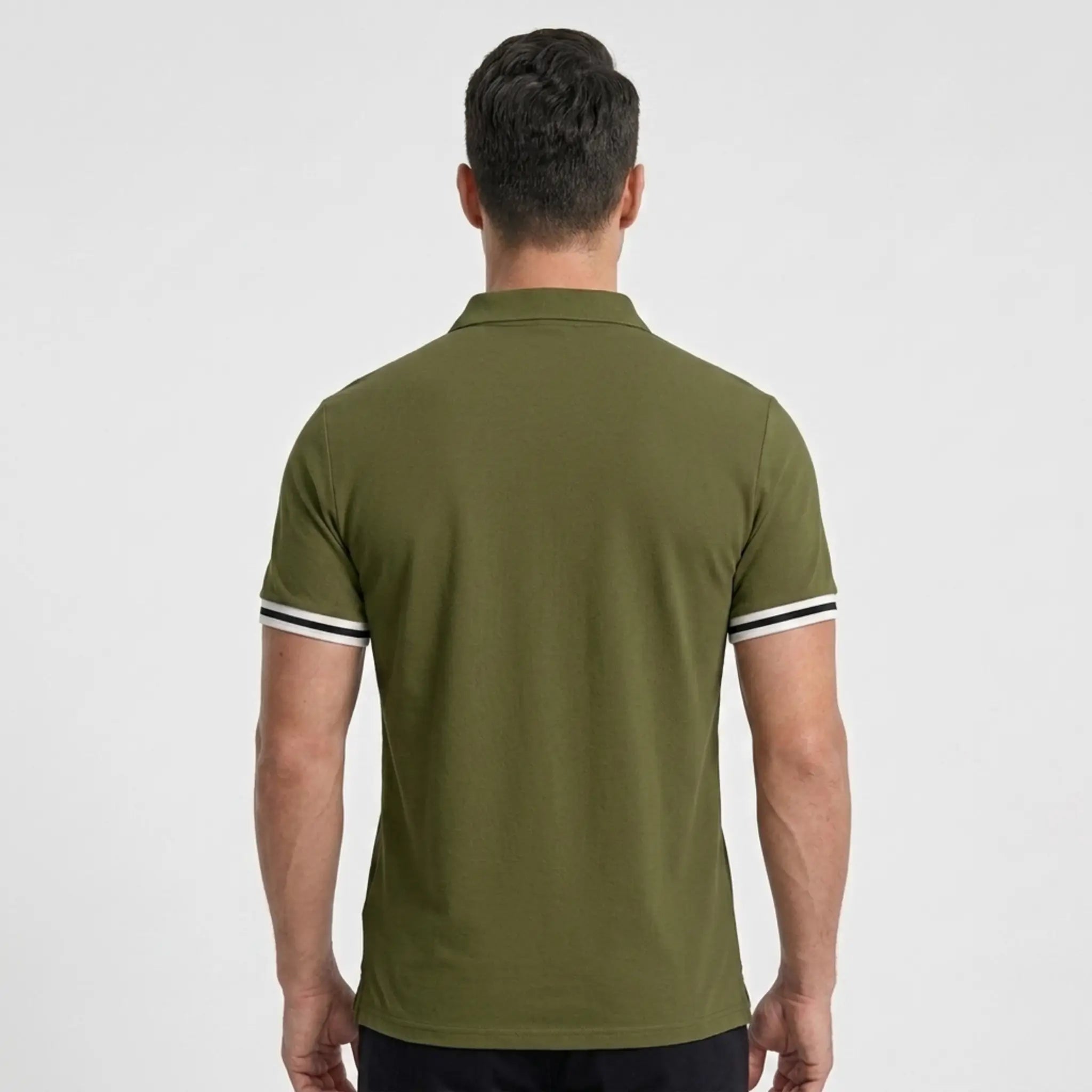 MannerCo military green polo shirt back view with white and black striped sleeve cuffs