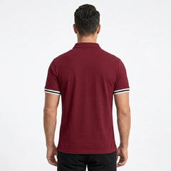 MannerCo wine red polo shirt back view with white and black striped sleeve cuffs
