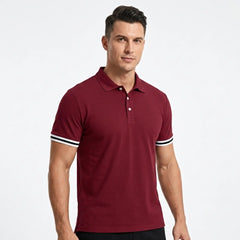 Man wearing MannerCo wine red polo shirt with striped cuffs and classic collar, front view