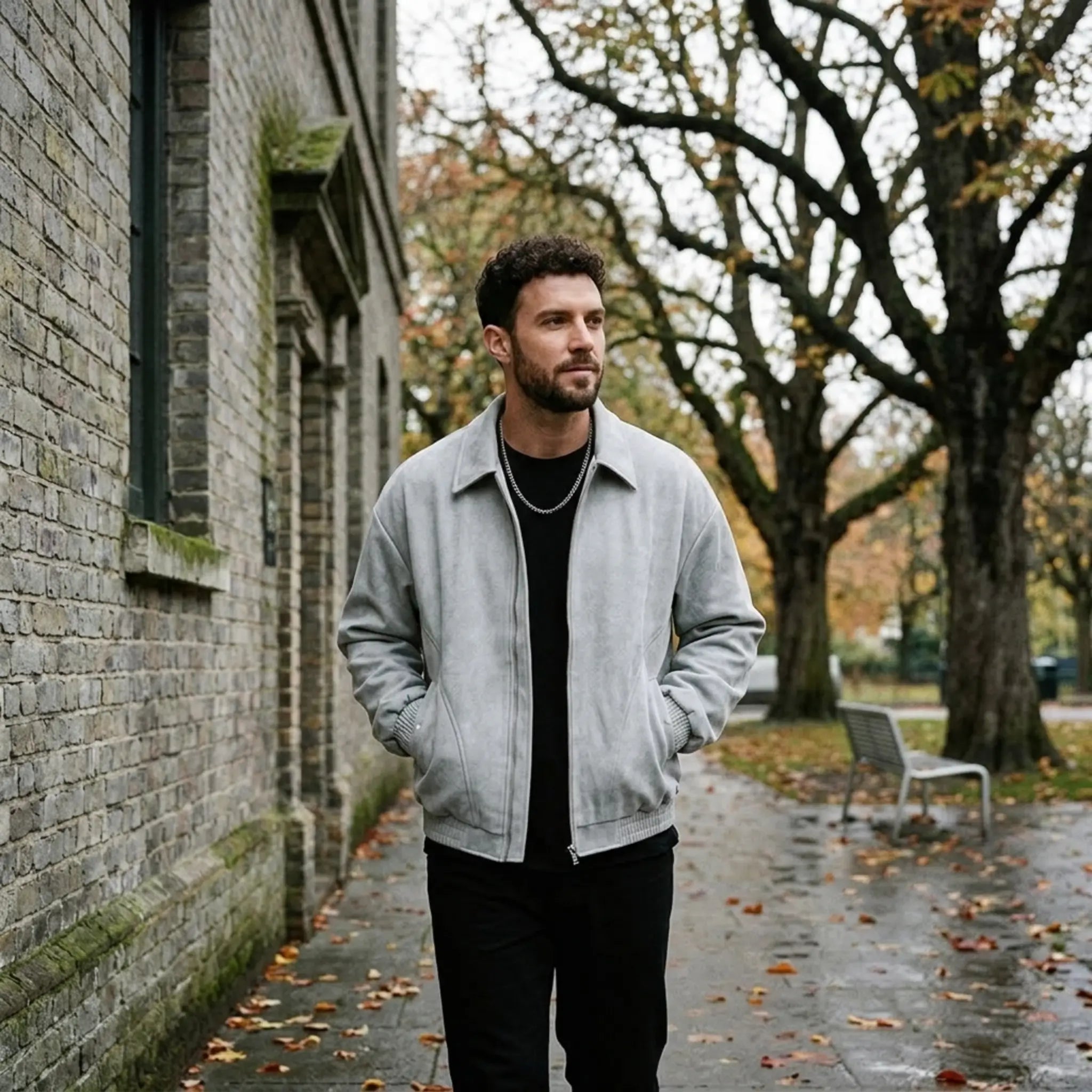 Man wearing MannerCo black PU leather retro lapel jacket with loose fit, front view