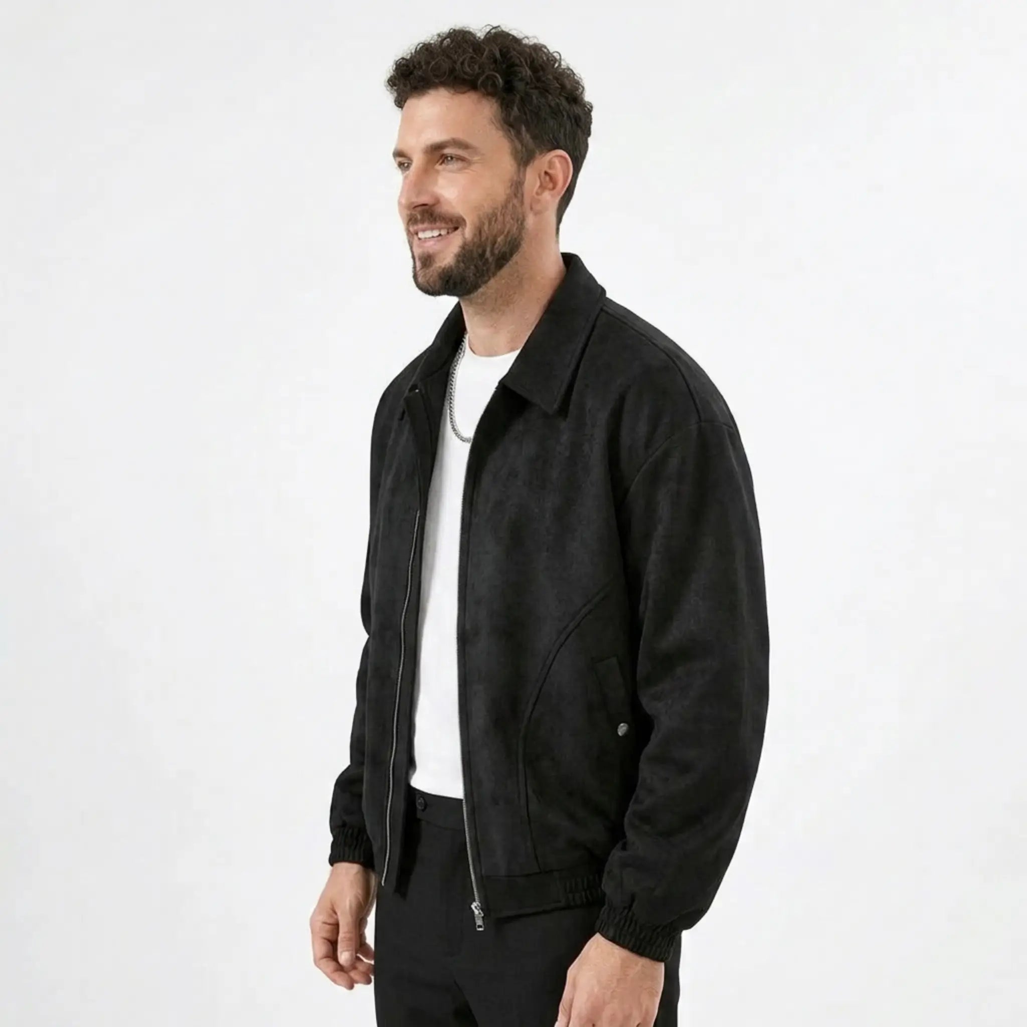 Man wearing MannerCo black PU leather retro lapel jacket in outdoor lifestyle setting