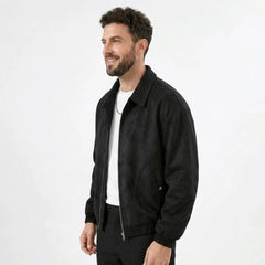 Man wearing MannerCo black PU leather retro lapel jacket in outdoor lifestyle setting