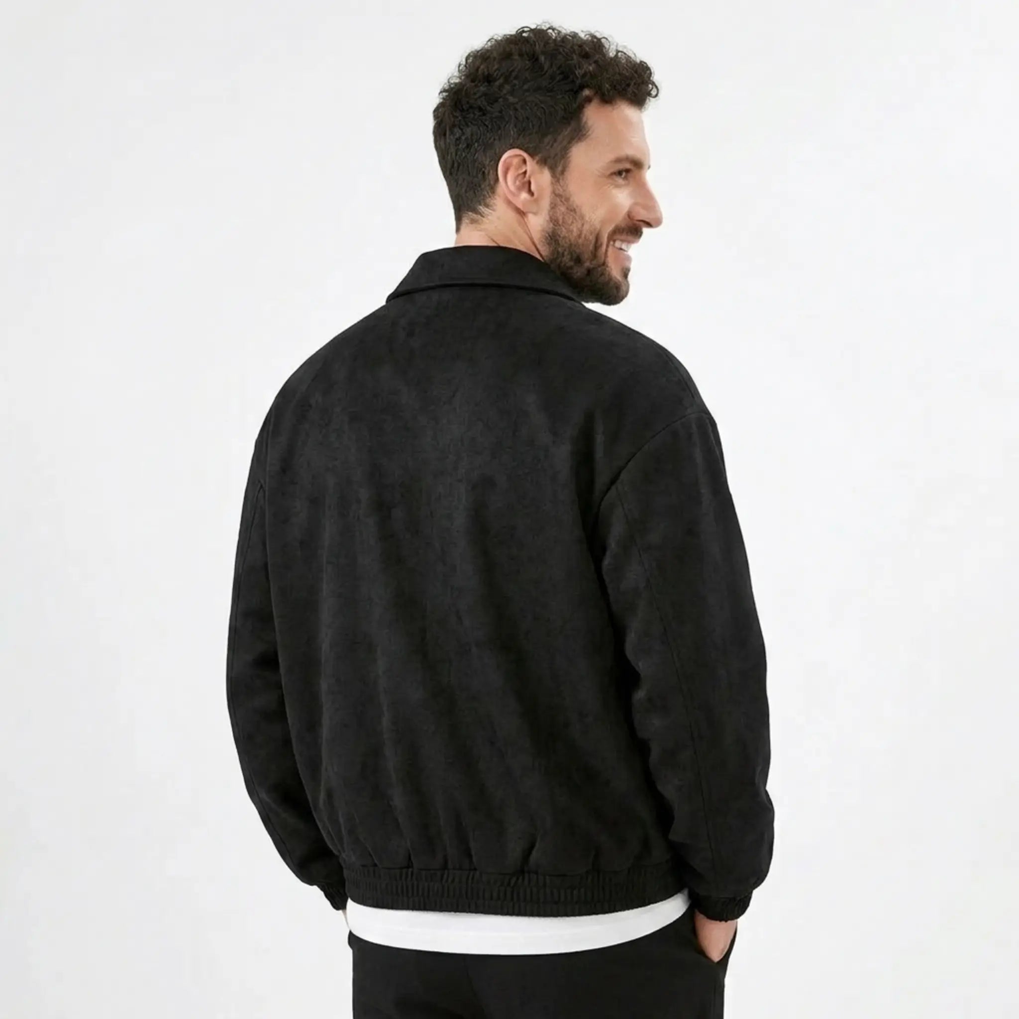 Man wearing MannerCo black PU leather retro lapel jacket in outdoor lifestyle setting