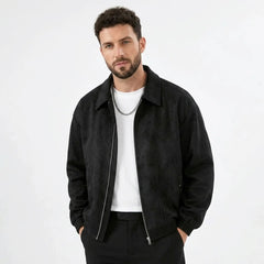 Man wearing MannerCo black PU leather retro lapel jacket in outdoor lifestyle setting
