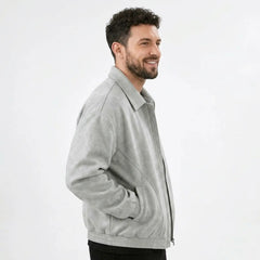 Man wearing MannerCo white PU leather retro lapel jacket, side view on plain background