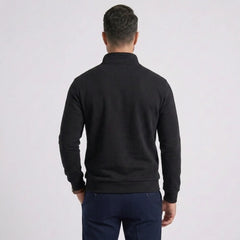 Man wearing MannerCo black quarter zip mock neck sweater slim fit, back view on plain background