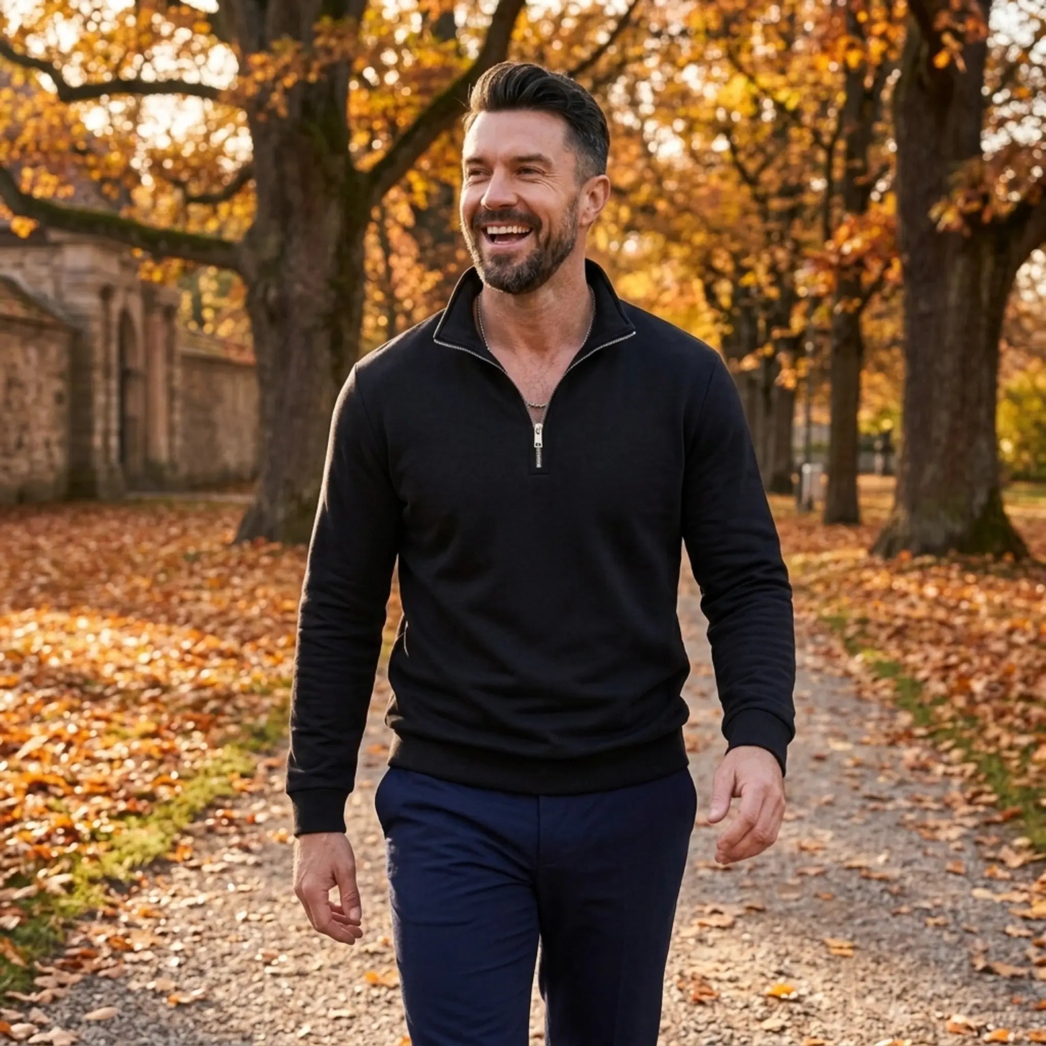 Man wearing MannerCo black quarter zip mock neck sweater in outdoor lifestyle setting