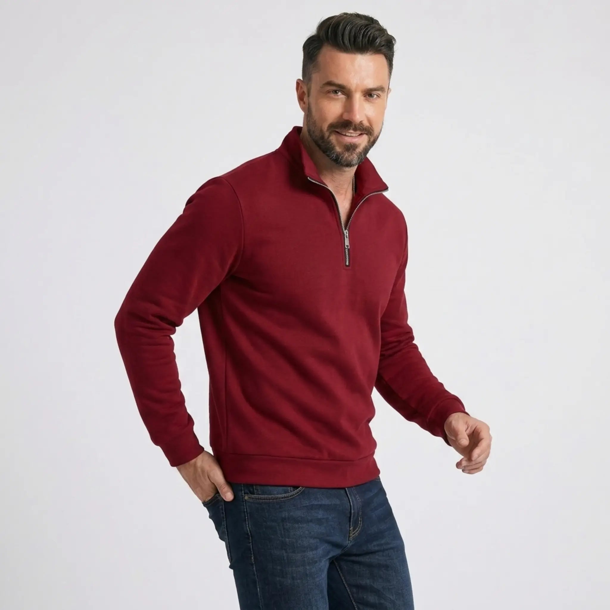Man wearing MannerCo burgundy quarter zip mock neck sweater slim fit, side view on plain background