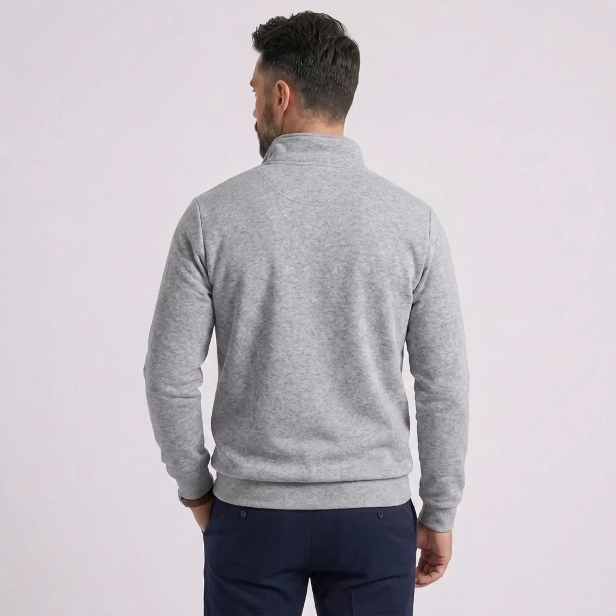Man wearing MannerCo gray quarter zip mock neck sweater slim fit, back view on plain background
