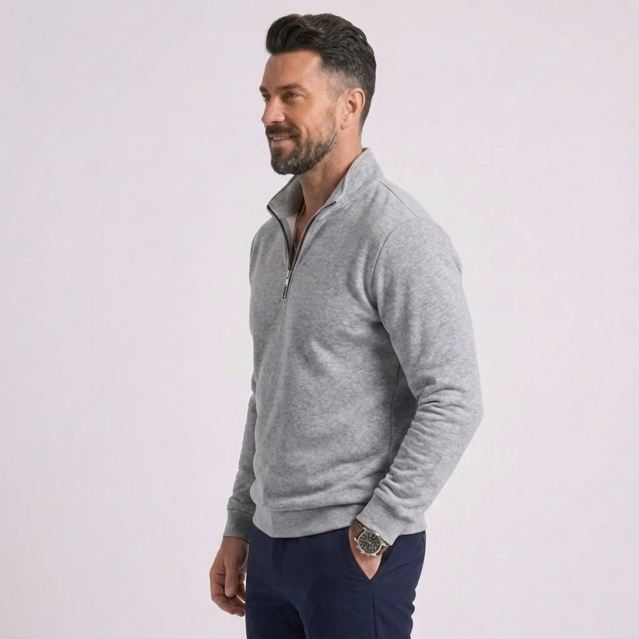 Man wearing MannerCo gray quarter zip mock neck sweater slim fit, side view on plain background