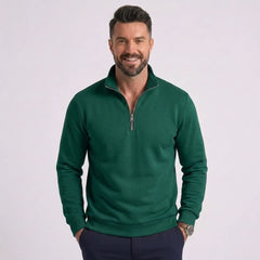Man wearing MannerCo green quarter zip mock neck sweater slim fit, front view on plain background
