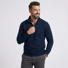 Man wearing MannerCo navy blue quarter zip mock neck sweater slim fit, front view on plain background