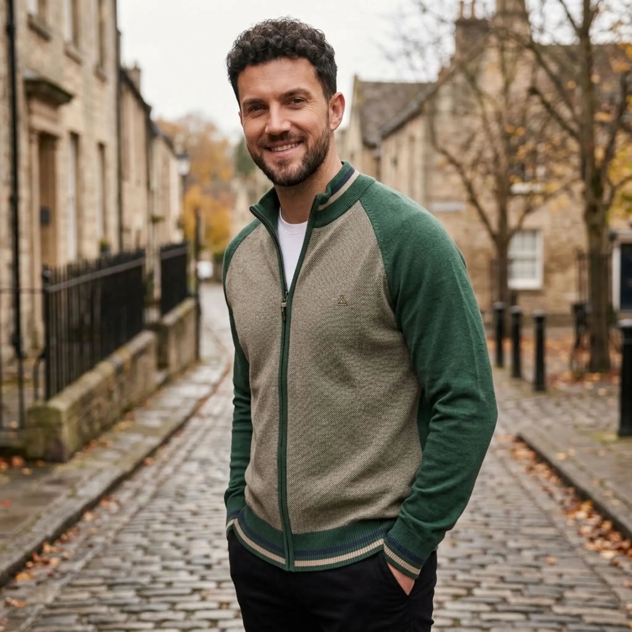 MannerCo green raglan sleeve cardigan with stand-up collar slim fit worn outdoors on cobblestone street
