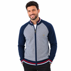 MannerCo navy raglan sleeve zip cardigan sweater with striped trim and stand-up collar on male model
